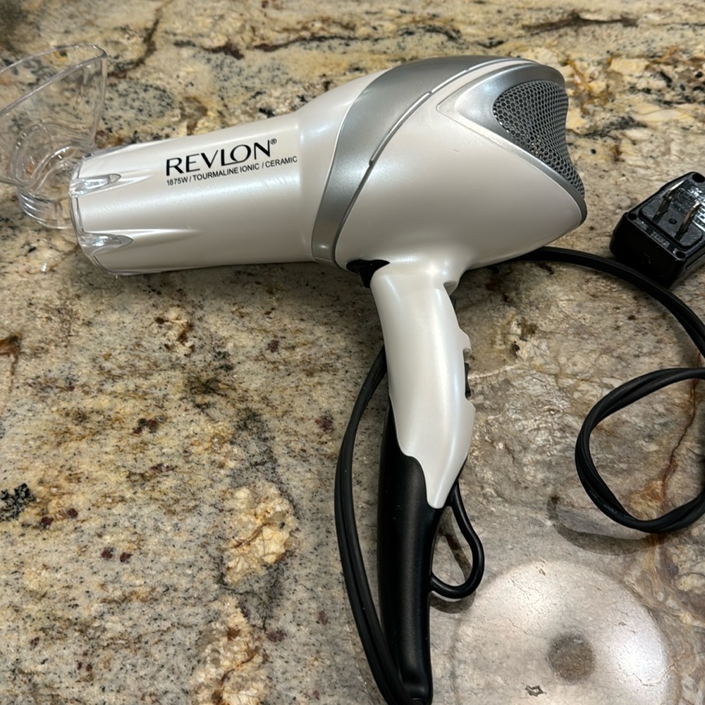 Revlon blow drier with one attachment. Used a handful of times.